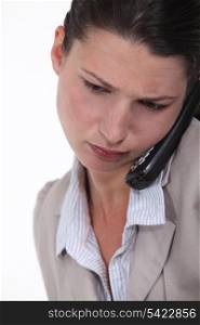 Businesswoman concentrating during call
