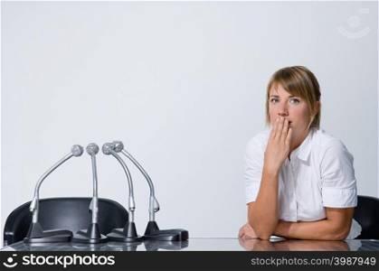 Businesswoman covering mouth