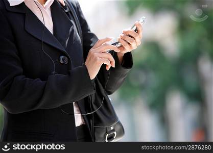 Businesswoman Dialing Cell Phone