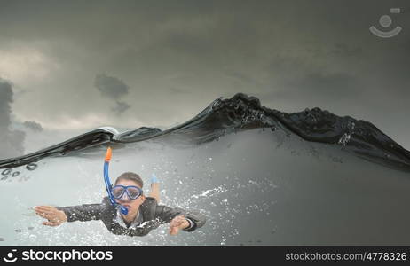 Businesswoman diver in mask. Young businesswoman in suit and diving mask swimming under water