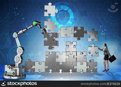 Businesswoman doing jigsaw puzzle with robotic arm