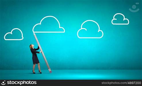 Businesswoman drawing cloud in sky with huge pencil. My great idea