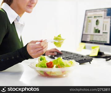 businesswoman eating salad
