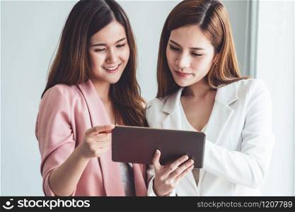 Businesswoman executive is in meeting discussion with another businesswoman or client in modern workplace office. People corporate business team concept.