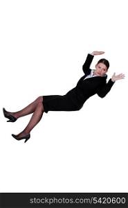 Businesswoman falling backwards