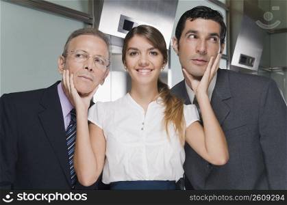 Businesswoman flirting with two businessmen
