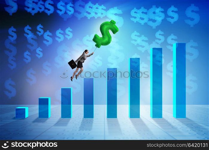 Businesswoman flying on dollar sign inflatable balloon over financials charts. Businesswoman flying on dollar sign inflatable balloon over fina