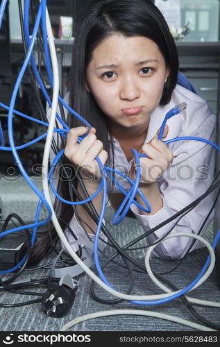 Businesswoman Frustrated by Ethernet Cord