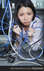 Businesswoman Frustrated by Ethernet Cord
