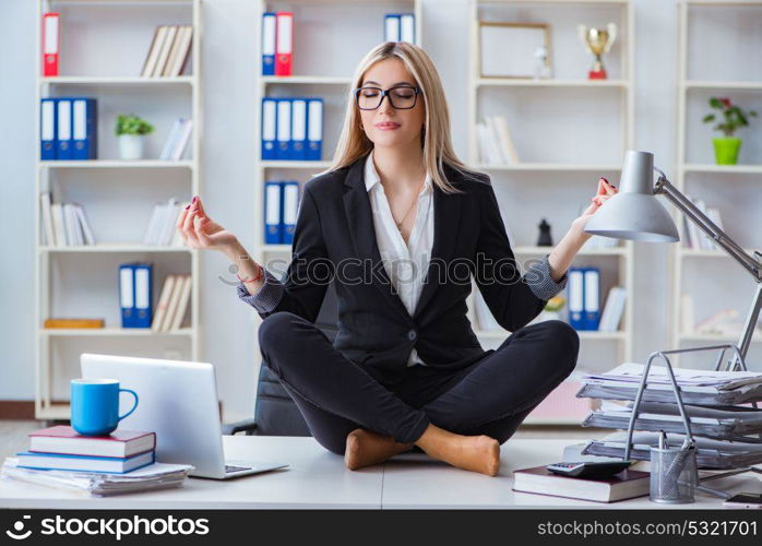 Businesswoman frustrated meditating in the office