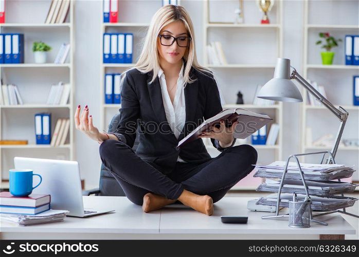 Businesswoman frustrated meditating in the office