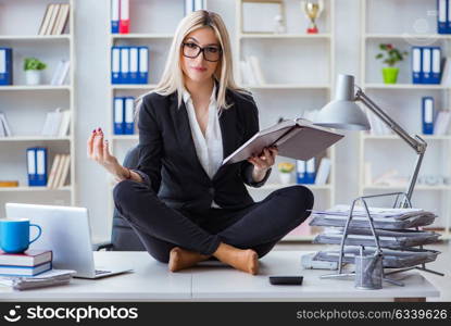 Businesswoman frustrated meditating in the office