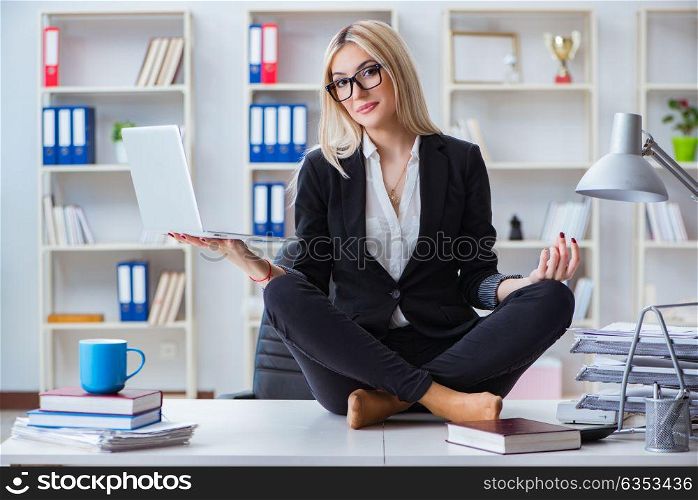 Businesswoman frustrated meditating in the office