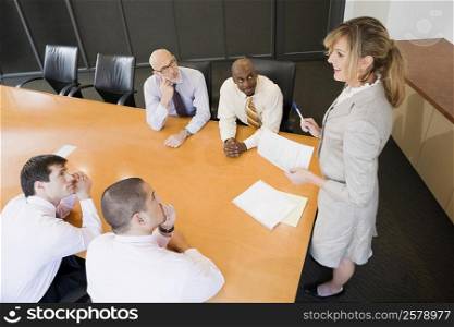 Businesswoman giving a presentation in a board room