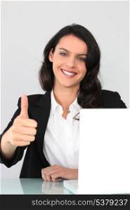 Businesswoman giving the thumbs up