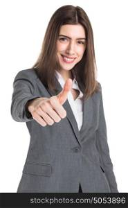 Businesswoman giving thumb up. Confident young businesswoman giving the thumb up isolated on white background