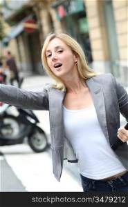 Businesswoman hailing for a cab
