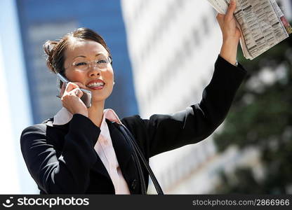 Businesswoman Hailing Taxi