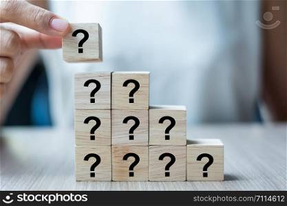 Businesswoman hand placing or pulling Red arrow wooden block on table background. Business Growth, Improvement, strategy and Successful Concepts