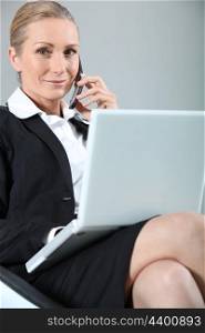 Businesswoman happy during call