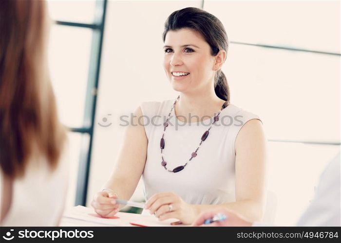 Businesswoman having a discussion with her collegues