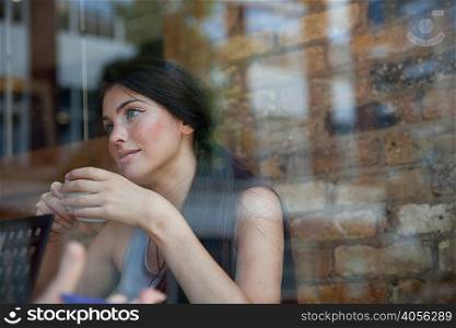 Businesswoman having meeting in coffee bar, London