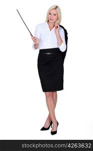 Businesswoman holding a conductor&acute;s baton