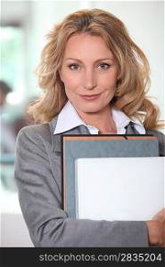 Businesswoman holding a folder