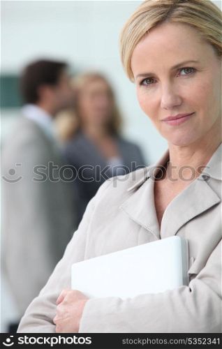 businesswoman holding a laptop