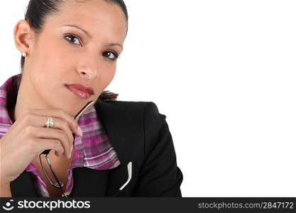 Businesswoman holding a pair of glasses