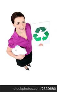 businesswoman holding a recycling label