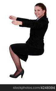 Businesswoman holding an invisible object