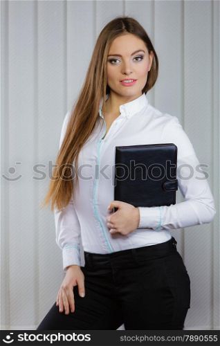 businesswoman holding document case. Elegant young woman blond girl with briefcase indoor. Corporate business.