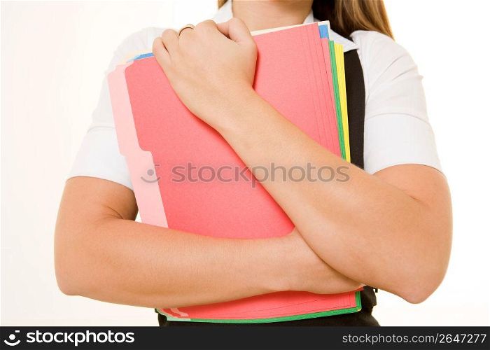 Businesswoman holding files, close-up