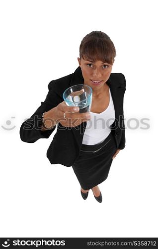 Businesswoman holding glass of water