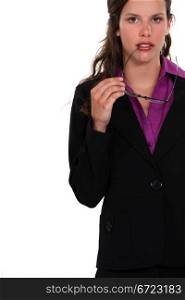 Businesswoman holding glasses to mouth