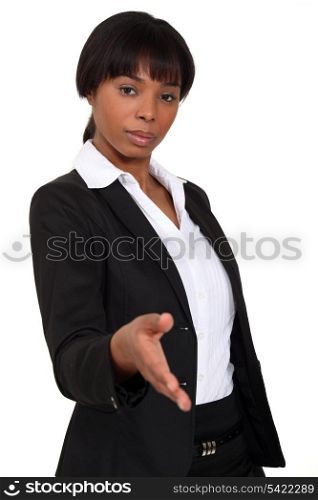Businesswoman holding hand out