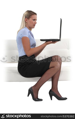 Businesswoman holding her laptop