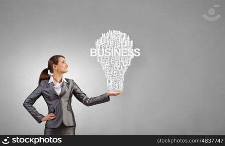 Businesswoman holding in hands successful idea concept. Woman presenting idea