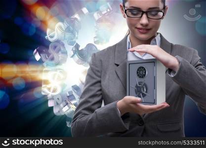 Businesswoman holding metal safe in security concept