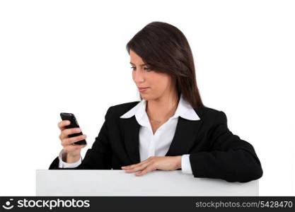 Businesswoman holding mobile telephone