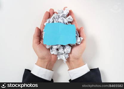 Businesswoman Holding Paper Wraps And Important Message On Top.. Businesswoman Holding Paper Wraps And Important Message On Top. Woman Having Crumpled Notes And Crutial Information In Hands. Palms Full With Wrinkled Notepaper And Memo..