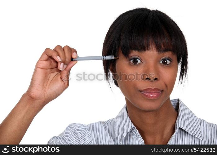 Businesswoman holding pen