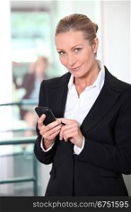 businesswoman holding phone