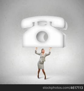 Businesswoman holding phone. Image of businesswoman holding macro sign of telephone