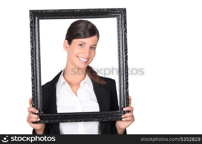 Businesswoman holding picture frame