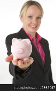 Businesswoman Holding Piggy Bank