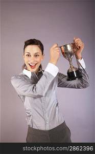 Businesswoman Holding Trophy