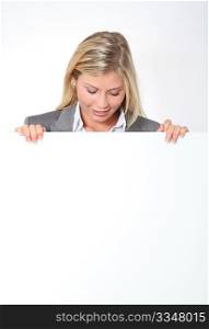 Businesswoman holding white panel
