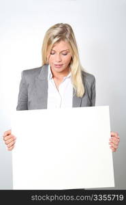 Businesswoman holding white panel